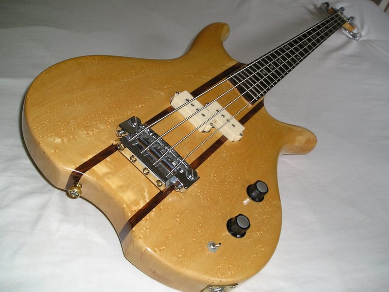 Bird's eye maple body electric bass guitar (by PublicDomainPictures@pixabay)